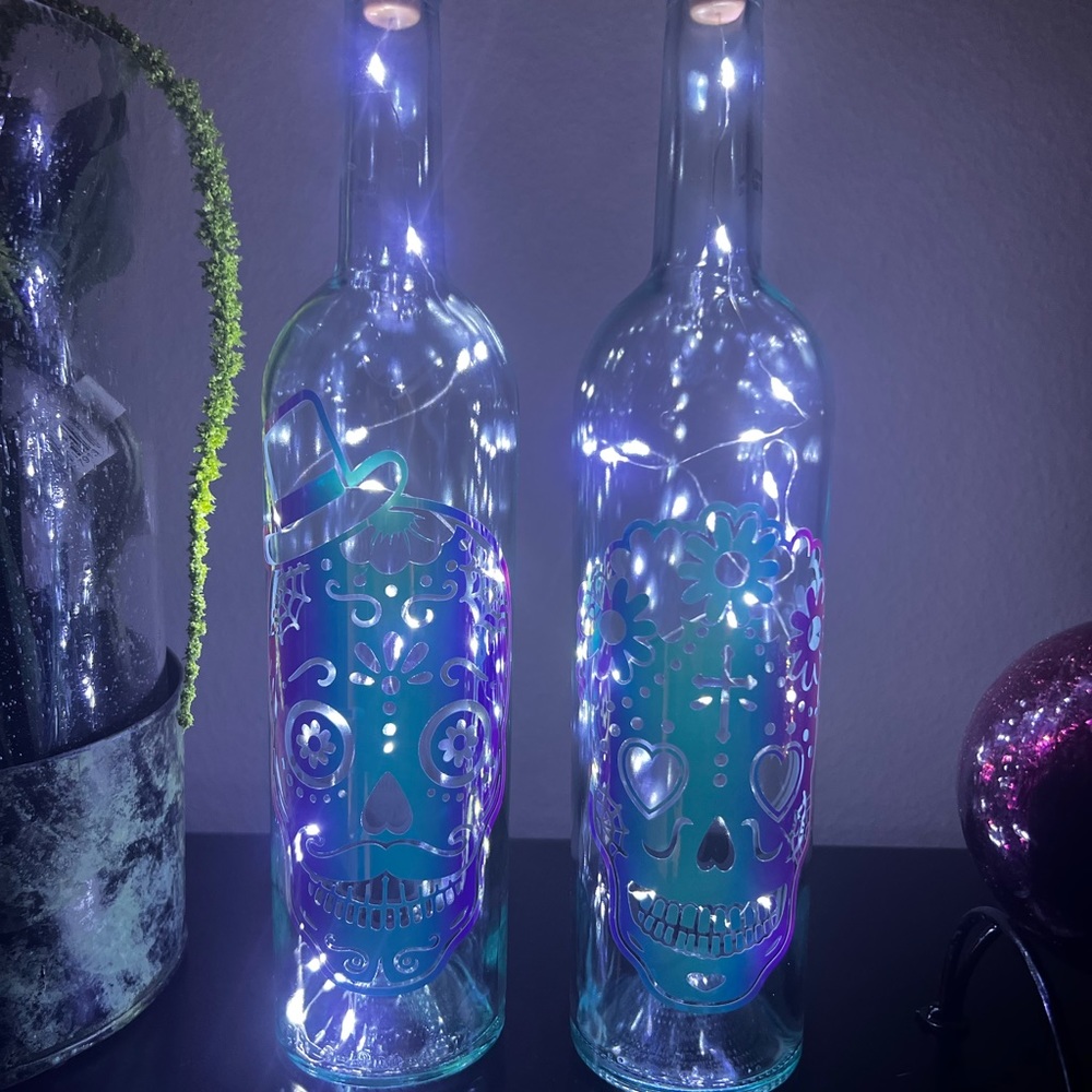Sugar skulls light up wine bottles